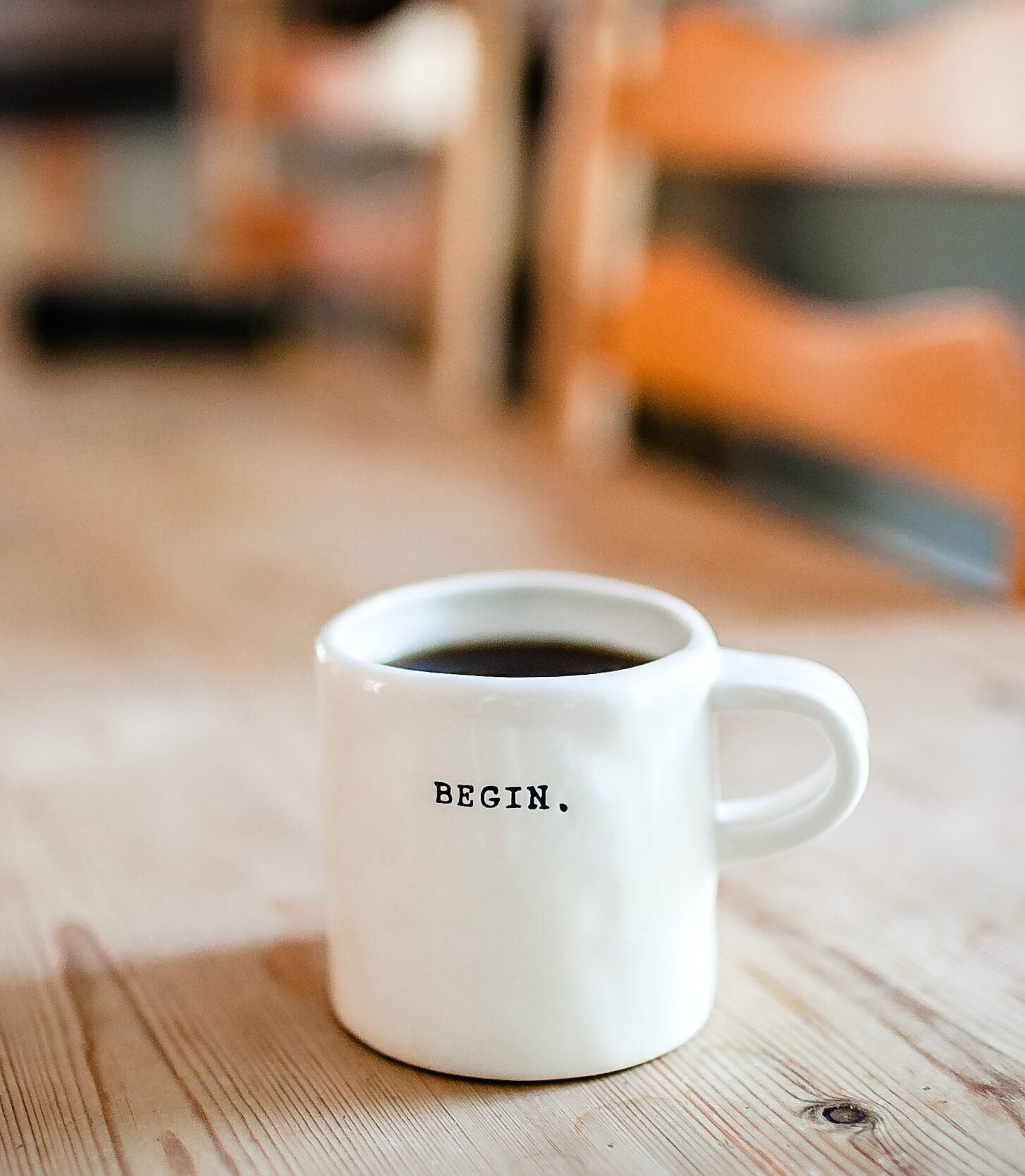 Coffee cup with the word begin