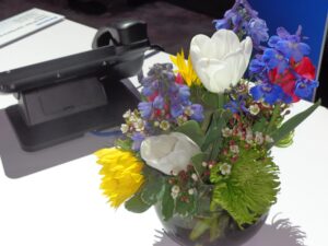 desk with flowers in vase