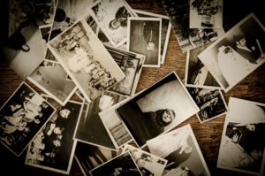 pile of black and white photographs in no apparent order